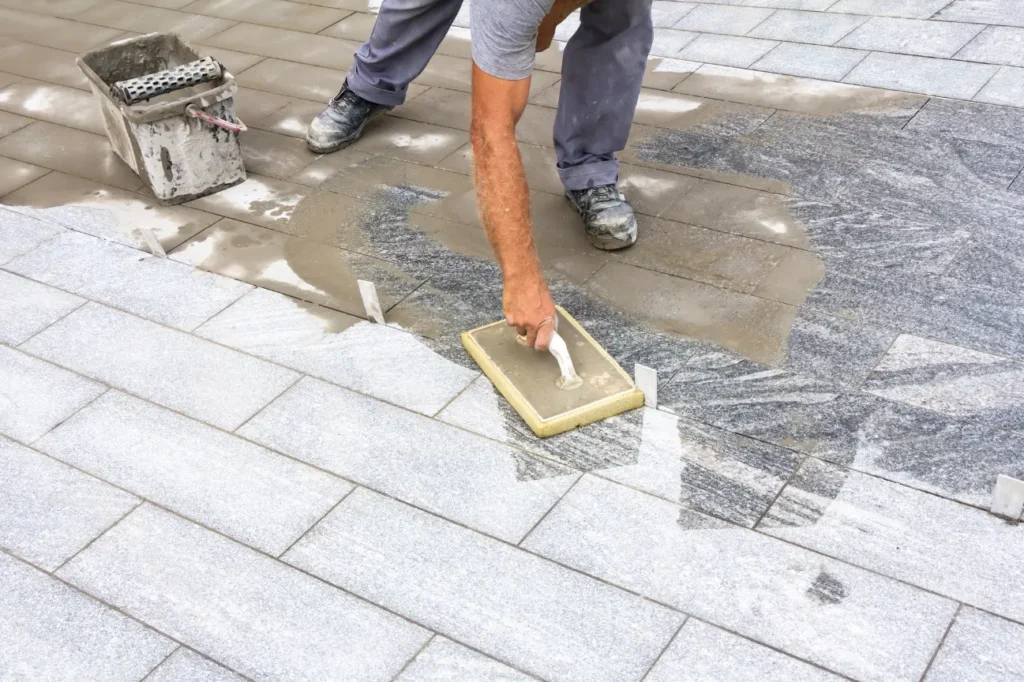 Friendly Build & Fix delivering expert tiling services with precision during outdoor tile installation