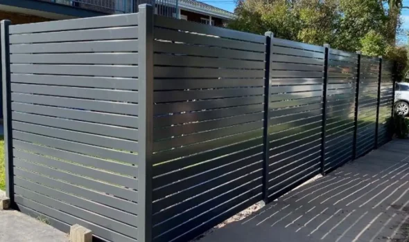 Stylish dark grey Colorbond fencing installed by Friendly Build & Fix for privacy and durability