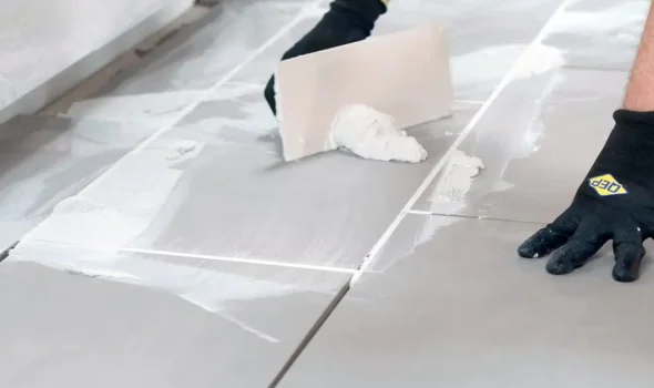 Meticulous tiling craftsmanship by Friendly Build & Fix showcasing expert grout work